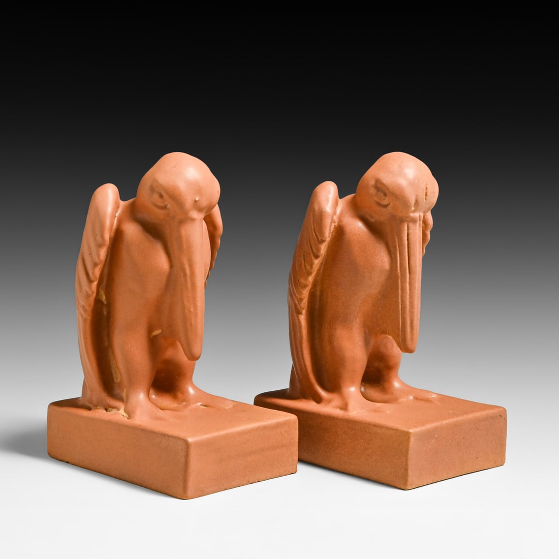 Teco Pottery Stylized Pelican Bookends c1905: Teco Pottery Stylized Pelican Bookends c1905. Signed. Invisible professional restoration to edge chips, otherwise perfect condition. 6.75"h x 4.5"d x 3"w FREE NATIONWIDE SHIPPING Free Nationwide Shipp