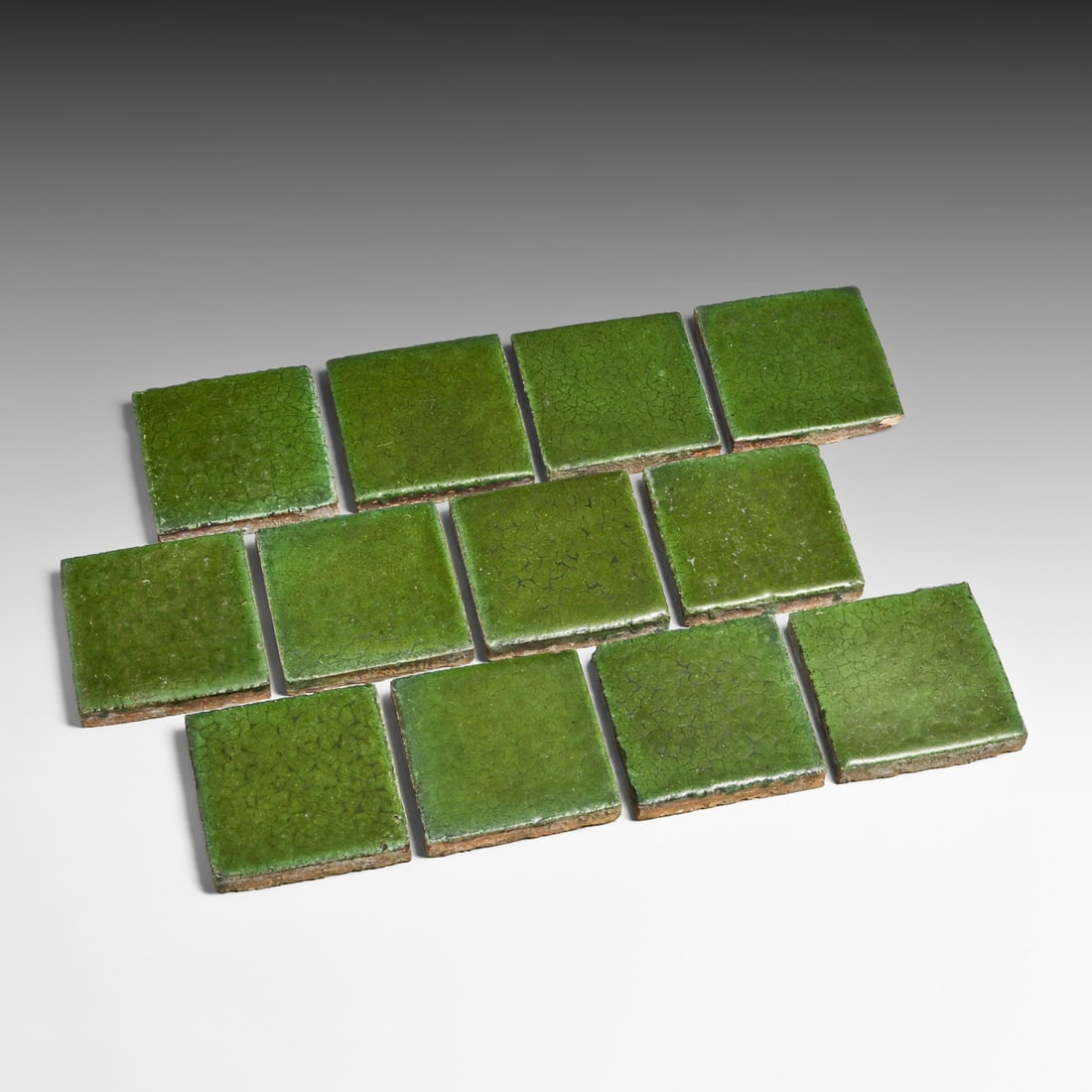 Complete Set of (12) Grueby Faience 4x4 Matte Green Tiles c1902-1905: Complete Set of (12) Grueby Faience 4x4 Matte Green Tiles c1902-1905. Perfect for Gustav Stickley 12-Tile table restoration if one ever turns up without tiles. Unsigned. Small chips to edges and corne