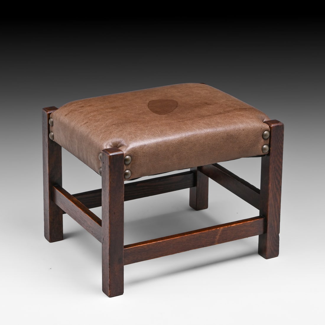 Gustav Stickley #300 Oak Footstool c1910.: Gustav Stickley #300 Oak Footstool c1910. Unsigned. Excellent original finish. Stain to leather. 16.25"h x 20.25"w x 16.25"d FREE NATIONWIDE SHIPPING Free Nationwide Shipping within the lower 48 state