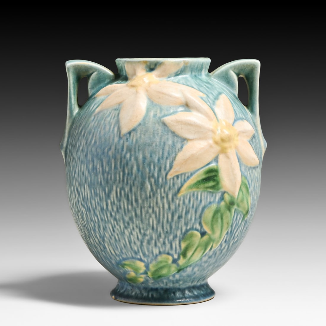 Roseville Pottery "Clematis" Two-Handled Vase 1944: Roseville Pottery "Clematis" Two-Handled Vase 1944. Signed. Small chip to base rim, otherwise perfect condition. 8.5"h x 8"d FREE NATIONWIDE SHIPPING Free Nationwide Shipping within the lower 48 state