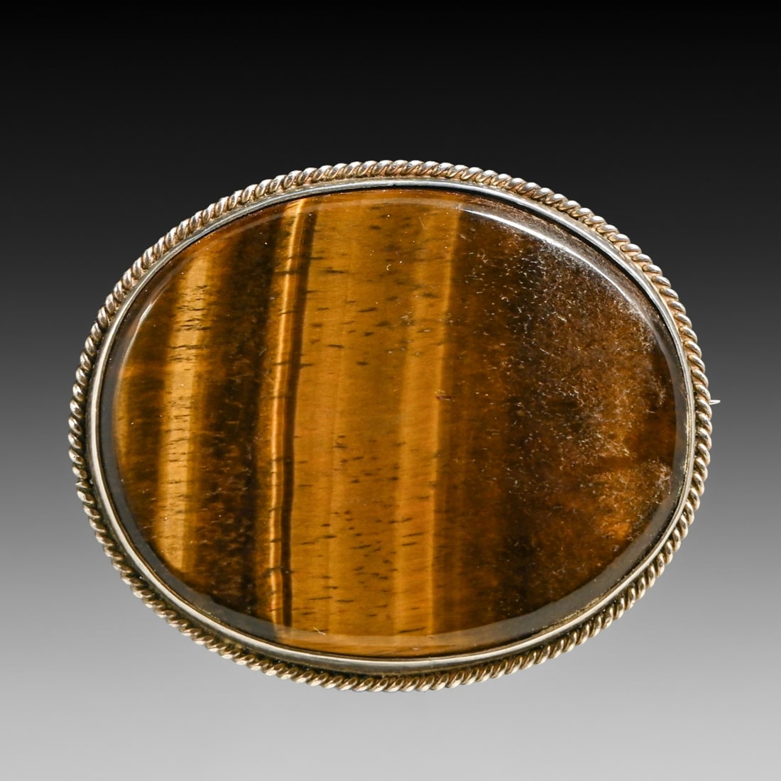 Arts & Crafts Period Sterling Silver & Tiger's Eye Brooch c1910s: Arts & Crafts Period Sterling Silver & Tiger's Eye Brooch c1910s. 1.75"h x 2.25"w FREE NATIONWIDE SHIPPING Free Nationwide Shipping within the lower 48 states for all purchases at our Two-Day