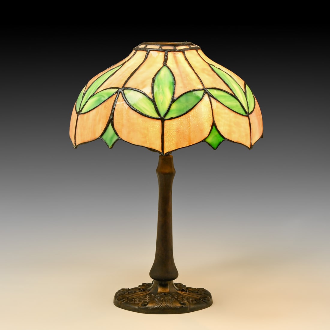 Bradley & Hubbard Leaded Glass Table Lamp c1910: Bradley & Hubbard Leaded Glass Table Lamp c1910. Unmarked. Missing its original matching heat cap and finial, otherwise excellent original condition with an intact leaded shade and a rich, multi-toned