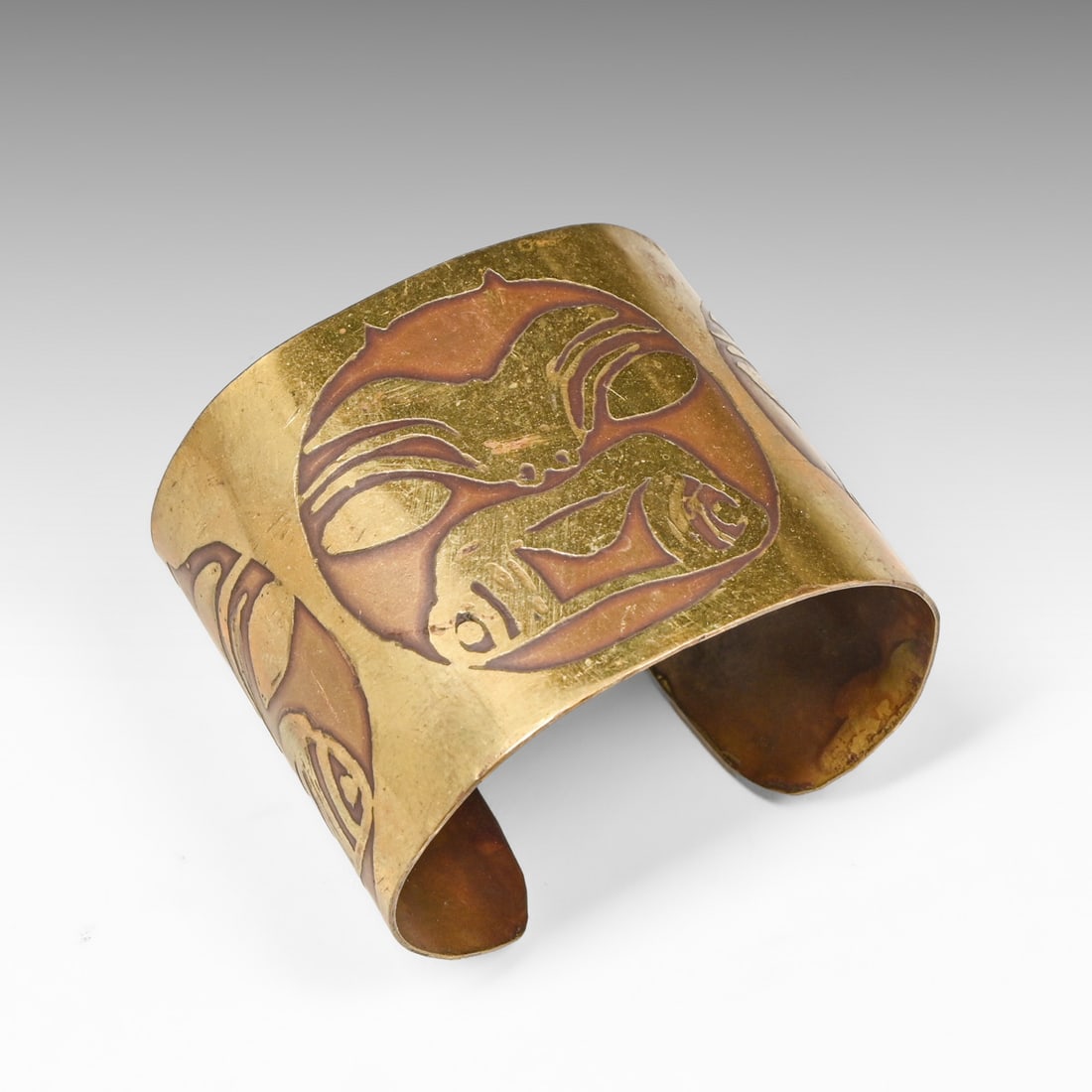 Northwest Coast Native Acid-Etched Brass Cuff Bracelet c1920s-1950s: Northwest Coast Native Acid-Etched Brass Cuff Bracelet c1920s-1950s. Unsigned. Excellent original patina. Height: 2". Inner width: 2.5". Metal wrap length: 6". Opening: 1.125" FREE NATIONWIDE SHIPPING