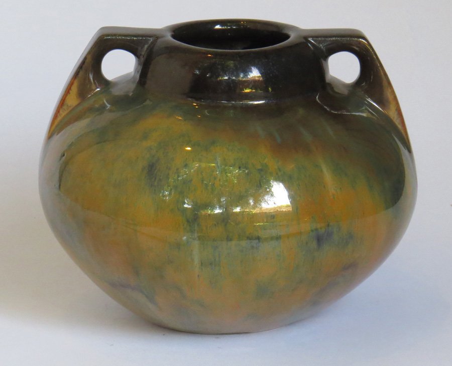 Fulper Bulbous 2-Handle Vase: Fulper bulbous 2-handle vase with a butterscotch-mirror black flambe glaze. "Fulper" inkstamp mark on bottom. 6"h x 7"d. Shipping: We box and ship ourselves, to keep shipping costs low. We do not use