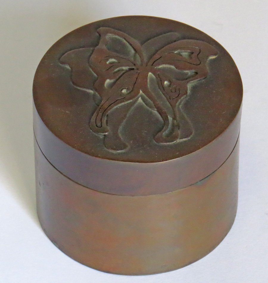 Copper Butterfly Box: Arts & Crafts round copper box or cannister with cutout butterfly design. Unsigned. 3"h x 3.75"d. Shipping: We box and ship ourselves, to keep shipping costs low. We do not use a packaging service, un