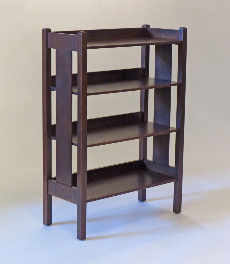 Gustav Stickley Bookshelf: Gustav Stickley bookshelf with one wide slat on each side. Signed with paper label under top. 38.5"h x 27"w x 12"d.Larger piece are shipped via Steve Auger Shipping. He travels coast to coast every mo