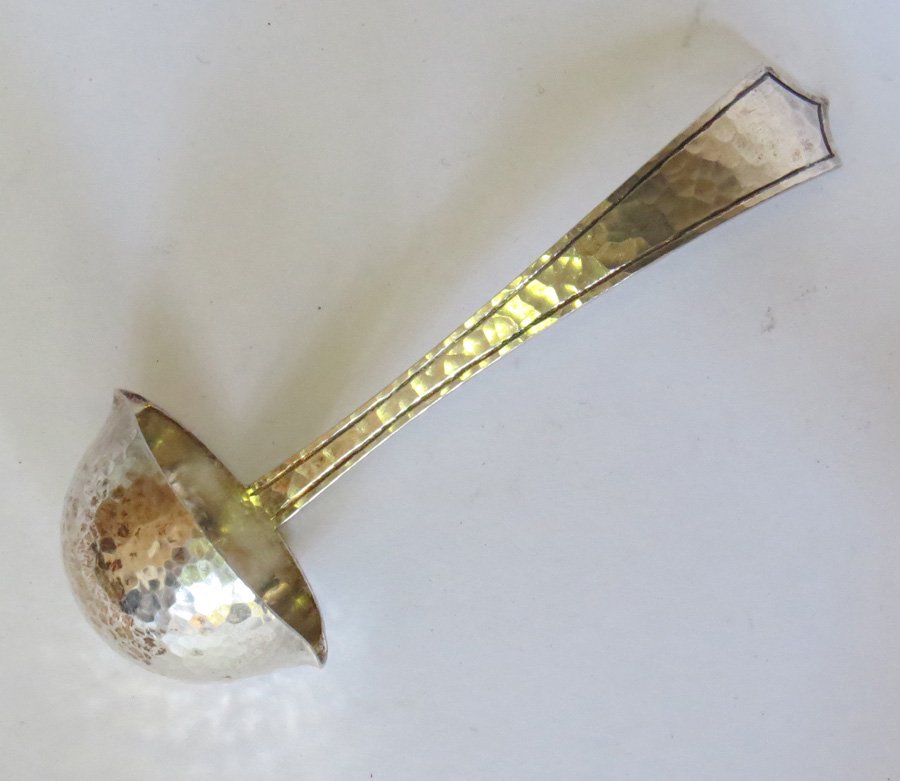 Marshall Fields Sterling Gravy Ladel: Marshall Field hammered sterling silver gravy ladel. Impressed "MF & Co Sterling Colonial 1042". 5".