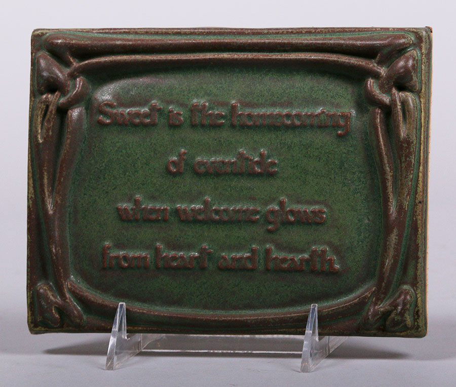 Motawi Motto Tile: Motawi Tileworks motto tile "Sweet is the homecoming of eventide when welcome glows from heart and hearth." Stamped "Motawi Tileworks Ann Arbor, MI" and "95/100" on reverse. 7.75" x 5.75". This lot is