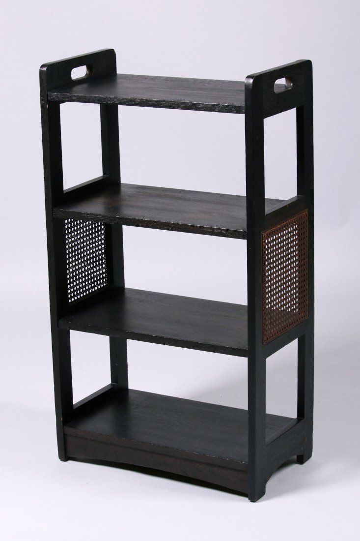 Grand Rapids Cane-Sided Magazine Stand: Grand Rapids cane-sided magazine stand. Unsigned. Original black finish. 39"h x 22"w x 12"d. This lot is being sold to benefit The Dirk van Erp Foundation. We box and ship ourselves, to keep shipping
