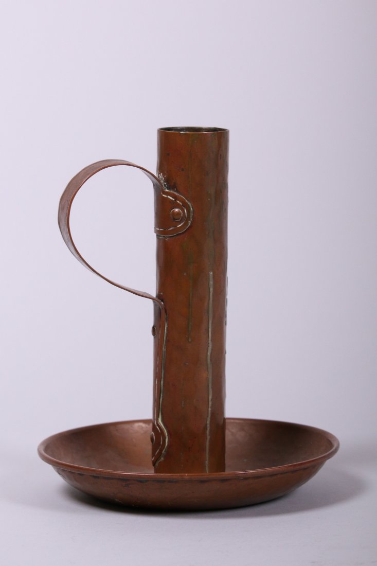 Gustav Stickley Hammered Copper Chamberstick: Gustav Stickley hammered copper chamberstick missing the bobeche insert at top. Signed on bottom. Original patina. 8.75"h x 7"d. This lot is being sold to benefit The Dirk van Erp Foundation. We box a