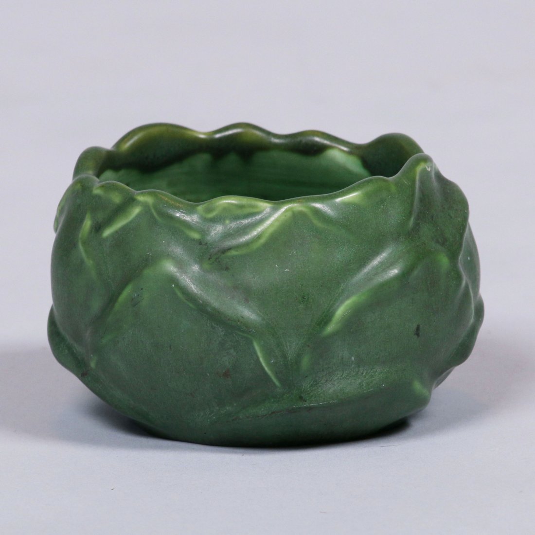 Hampshire Pottery Artichoke Bowl: Hampshire Pottery matte green artichoke bowl. Signed. 4.5"d x 2.75"h. This lot is being sold to benefit The Dirk van Erp Foundation. We box and ship ourselves, to keep shipping costs low. We do not us