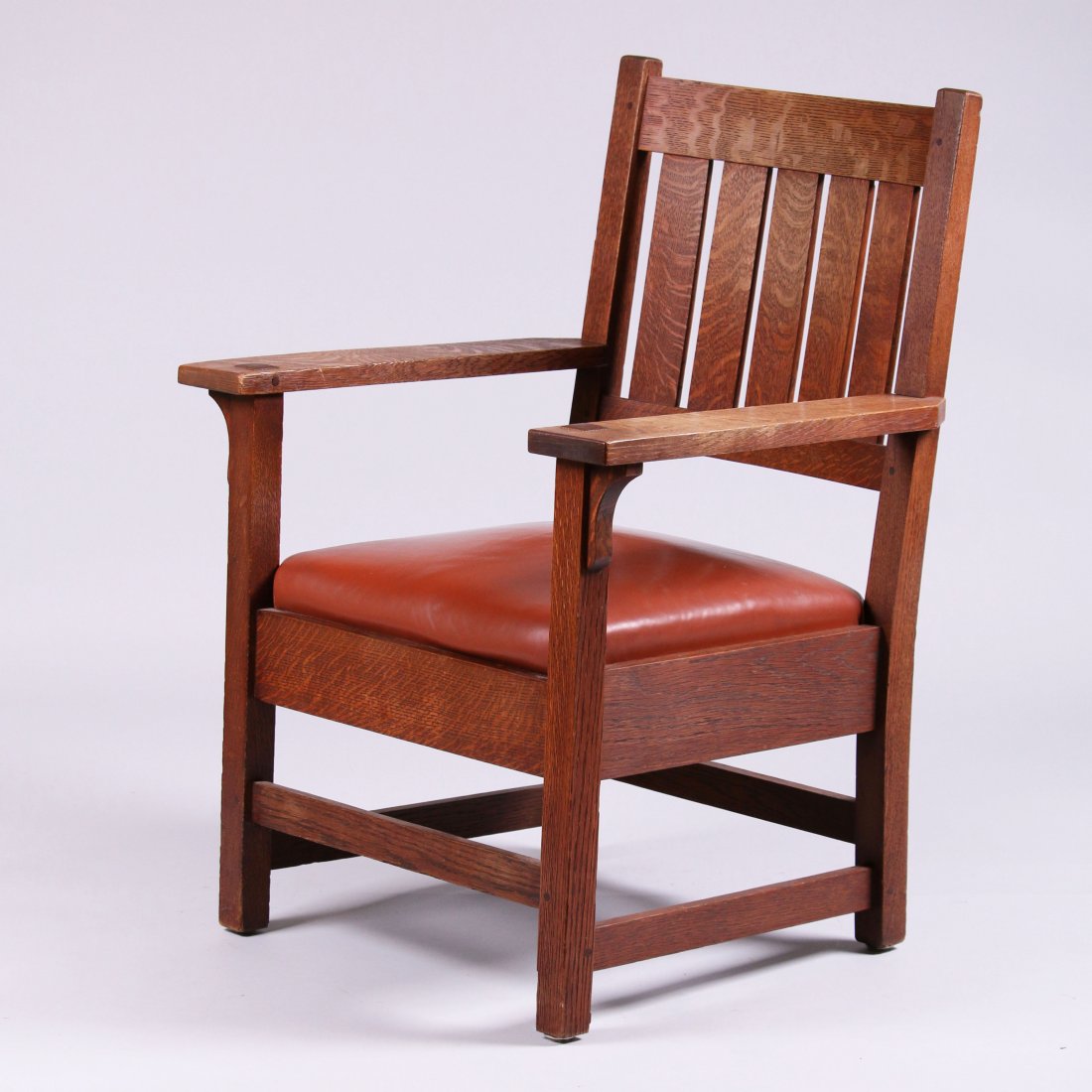 Gustav Stickley Armchair #318: Gustav Stickley armchair #318 with five vertical slats in back. Unsigned. Worn original finish. 37.5"h x 27"w x 24"d. This lot is being sold to benefit The Dirk van Erp Foundation. Larger piece are sh