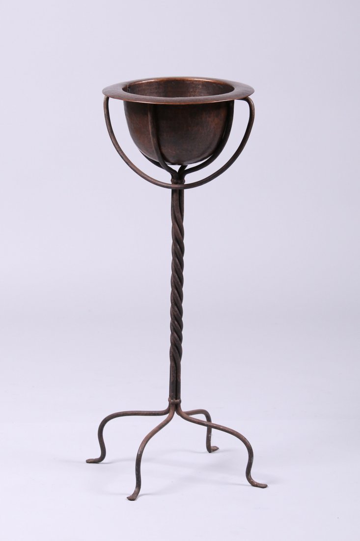 Harry Dixon Hammered Copper Plantstand: Harry St John Dixon hand-forged iron plant stand with a beautifully hammered copper basin. Impressed mark under edge of copper basin. Basin repaginated. Iron has its original patina. 29"h 11"d x 12"w.