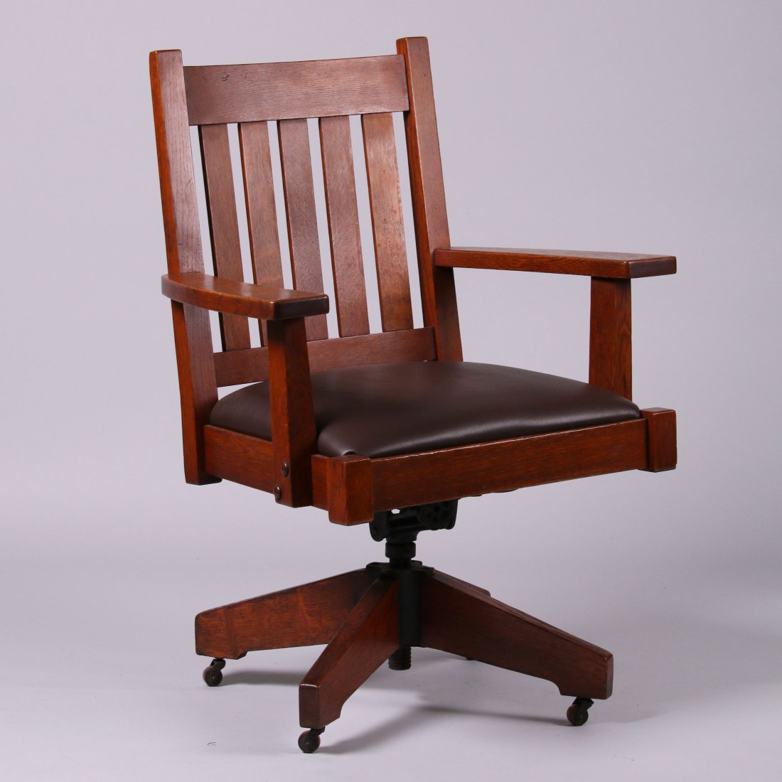 Stickley Brothers Oak Swivel Chair: Stickley Brothers oak swivel chair. Excellent original finish. Signed. Mechanism is very sturdy and is in perfect working order. 38"h x 28.25"w x 19"d.