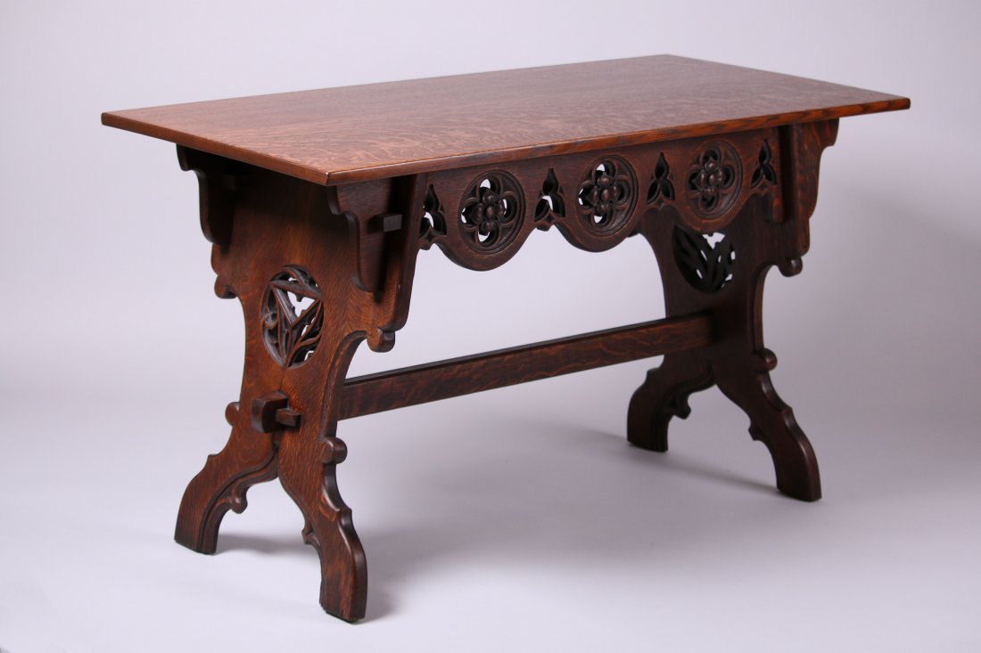 Arts & Crafts Carved Gothic Oak Trestle Table: Arts & Crafts carved oak gothic trestle table attributed to Biltmore Industries, Asheville, NC by Robert Edwards. Unsigned. Top refinished. Base has its original finish. 51.5"w x 29.5"h x 24.75"d.