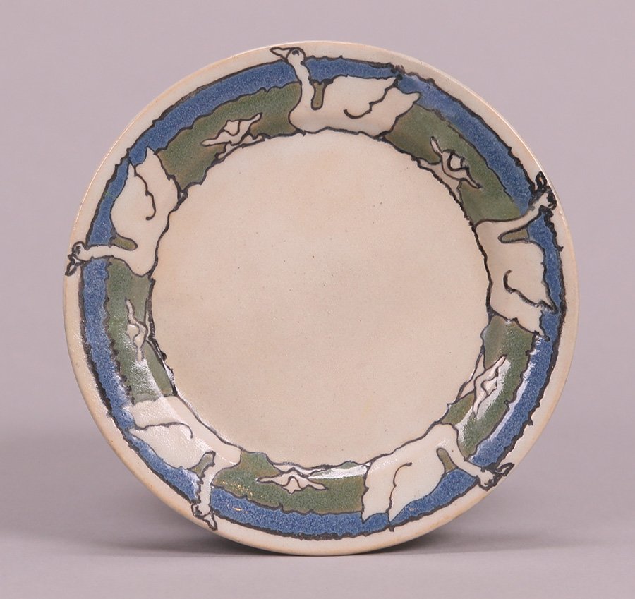 Saturday Evening Girls (S.E.G.) Swan Plate: Saturday Evening Girls (S.E.G.) swan plate by Sara Gelner dated 1/14 for January 1914. Professionally repaired. 6.25"d. 5% of this lot will benefit The Dirk van Erp Foundation. We box and ship ourselv