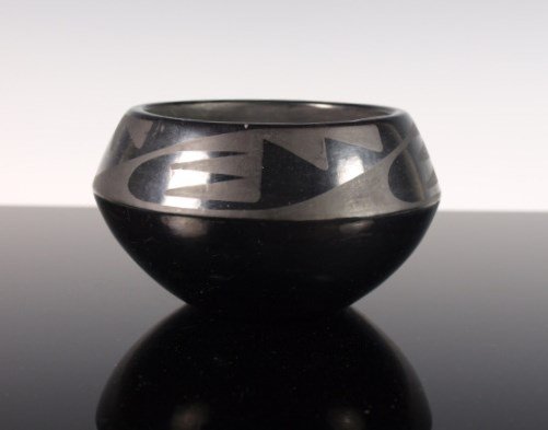 Marie & Julian Matte Black-On-Black Pottery Jar: A fine example by San Ildefonso Pueblo matriarch Maria Martinez, painted by her husband Julian, c. 1925-1943. Signed "Marie & Julian." Dimensions: 2 & 3/4 in. tall x 4 & 7/8 in. diameter.