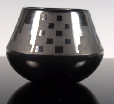 Marie & Julian Gunmetal Black-On-Black Pottery Jar: Matte black-on-black San Ildefonso ceramic jar with gunmetal finish by Marie (Maria) and Julian Martinez, San Ildefonso Pueblo, c. 1925-1943. Signed "Marie & Julian." Dimensions: 3 & 3/8 in. tall x 4