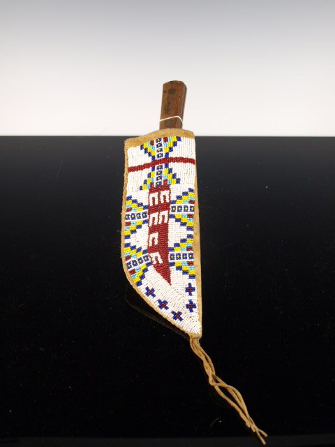 Sioux Beaded & Fringed Knife Sheath w/ Trade Knife: Sioux beaded knife sheath w/ trade knife, with horse-stealer tracks & cross designs done in trade beads. Beaded on one side, sinew-seem on edge. Fringed. Very early knife marked CASE XX 431-6. Knife i