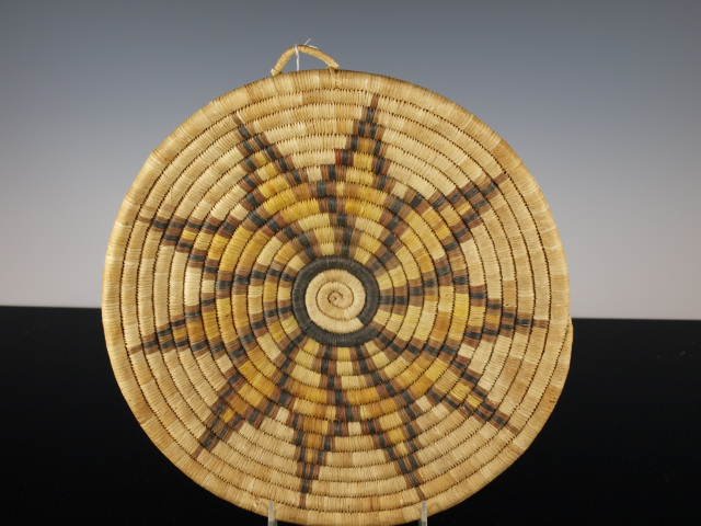 Polychrome Hopi Coiled Plaque: A Native American Hopi coiled polychrome plaque / tray with star design in center. Diameter: 11 in.