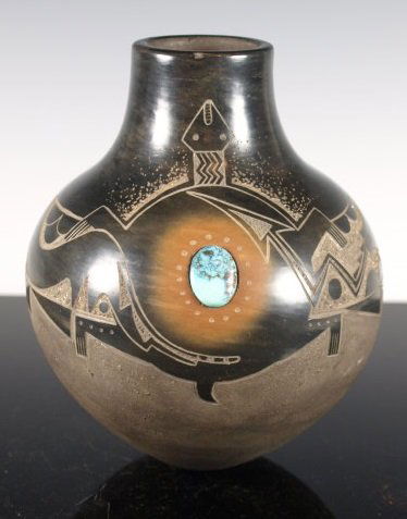 Black & Sienna Sgraffito Pottery Jar with Turquoise Set: Made by Russell Sanchez of San Ildefonso Pueblo. Micaceous slip, stone polished. A superb ealy piece by an enduringly creative artist. Dimensions: 6 & 3/8 in. tall x 4 & 7/8 in. diameter.