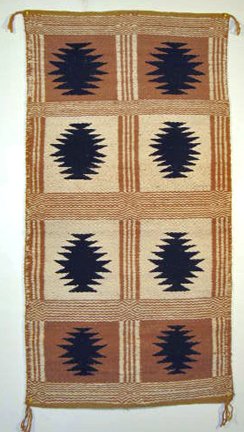 Rare Two-Faced Weave Navajo Rug: Two-faced rugs are difficult to make. Few weavers attempt them, and when they do, design often takes a back seat to technique. This example is very well drawn and executed. The gold is native plant dy