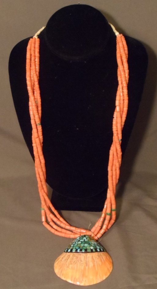 Early Santa Domingo Pueblo Shell and Turquoise Necklace: Early Santa Domingo Pueblo shell and turquoise necklace. The necklace is done with four strands of coral and turquoise heshe with a large shell pendant that has turquoise inlay. A very early extremely