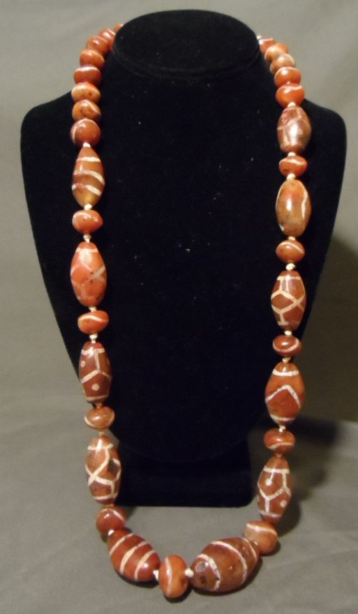 Rare Chinese Tibetan DZI, Tianzhu Bead Necklace: Rare Chinese Tibetan DZI, Tianzhu Bead Necklace likely Carnelian. This necklace is made of one strand of DZI (likely Carnelian) beads. From the estate of an important Malibu Collection. Very early ext