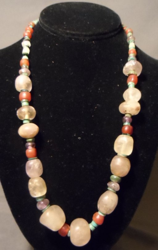 Pre-Columbian Aztec Quartz / Purple Quartz and Heshe: Pre-Columbian Aztec quartz/purple quarts necklace. This necklace is made of one strand of quartz, purple quartz and carnelian beads separated by turquoise heshe. 200 B.C. - 800 A.D. Length: 24 inches