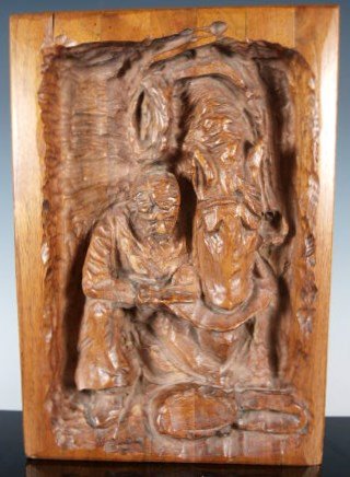 R. Mueller wood carving: dated verso 12-07-1985 a laminated, carved woodblock with the image of a cowboy giving his horse a drink from his hat. 10.5" x 7.5" titled "Friends'