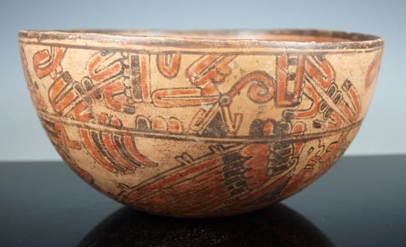 Mayan Ulua Valley Angel Bowl: Pre-Columbian, Mayan Territories, Honduras, Ca 550 to 900 CE. A classic Honduras Mayan angel bowl, large for your typical Mayan bowl. Ceramic vessel shows images of stylized dogs around the top, the f