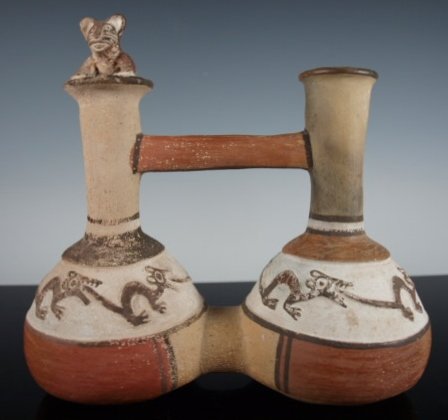 Peruvian Inca double chamber whistling vessel: A cute pre-Columbian Peruvian Inca double chamber whistling vessel 1200 AD - 1400 AD showing several jaguars chasing each other around each chamber. The whistle portion is a crouching jaguar sitting o