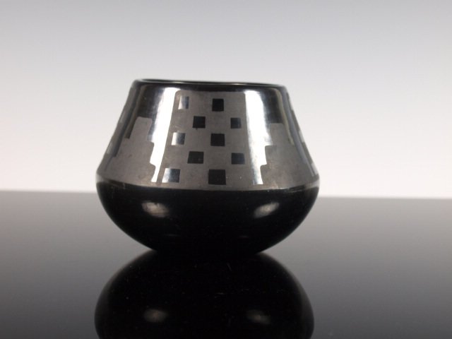 Marie & Julian Gunmetal Black-On-Black Pottery Jar: Matte black-on-black San Ildefonso ceramic jar with gunmetal finish by Marie (Maria) and Julian Martinez, San Ildefonso Pueblo, c. 1925-1943. Signed "Marie & Julian." Dimensions: 3 & 3/8 in. tall x 4