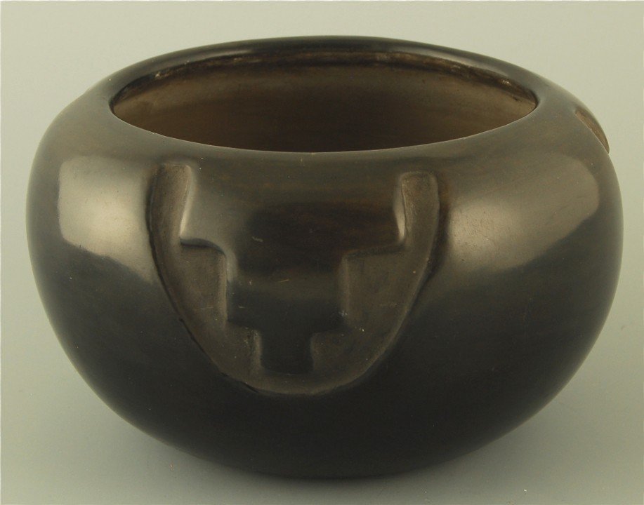 Juanita Gonzales San Ildefonso Pottery Bowl: Native American Carved bowl, some wear near base. Measuring 6”w x 3.5”h. Signed Juanita.
