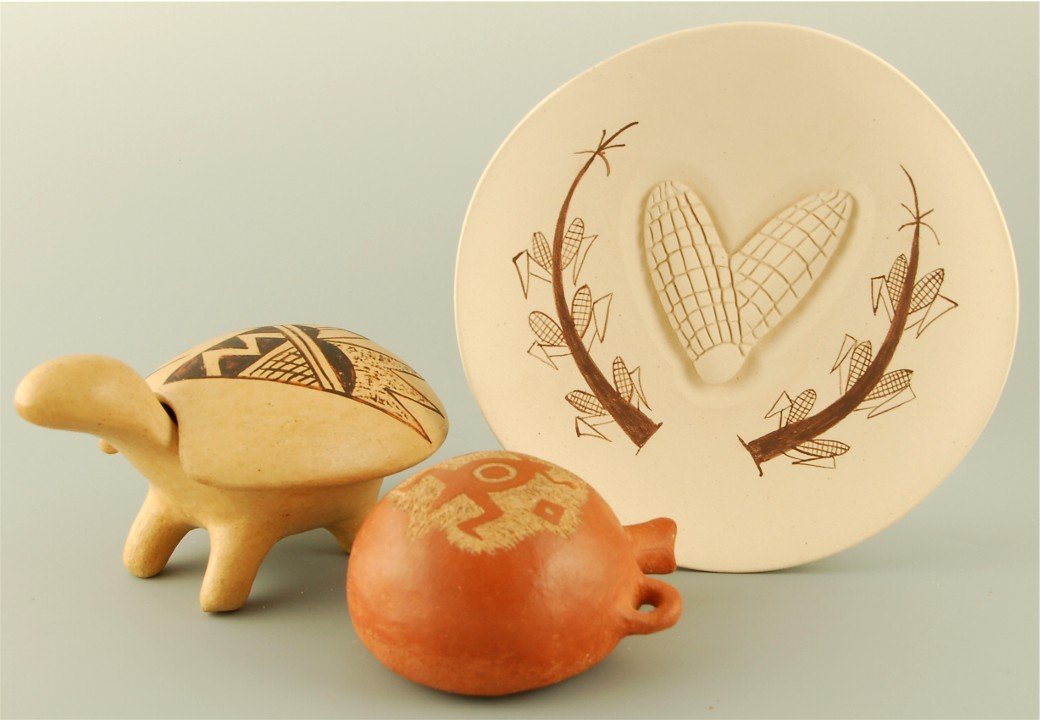 Hopi pottery group: Native American Turtle, two pieces, design on back, signed inside shell Marietta Poochea,3.5" h x 6" long. Unsigned canteen with incised animal, 3.5" w x 4" long, crack on back. Plate with incised cor