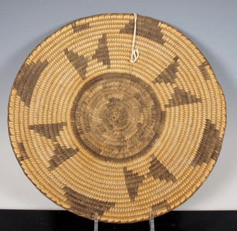 Early, butterfly Pima tray: An early Native American, turn of the century Pima basket with several butterfly designs 10 3/4 inches diameter