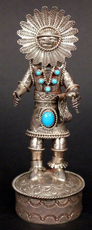 Sterling Silver & Turquoise Sun Kachina Doll: Native American Indian Navajo (Toby Henderson) sterling silver and turquoise accented Sun Kachina (Tawa) doll figurine with feathered headdress recalling the sun's rays. Spiritual figure holding bell