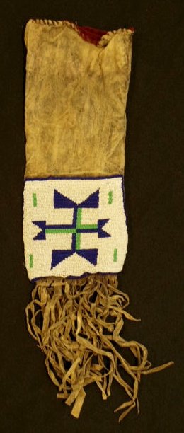 Northern Plains Indian Blackfoot Tobacco Bag: Native American beaded & fringed hide tobacco bag, Blackfoot, c. 1910. Spot-stitched beaded panel, typical of beadwork from the Northern Plains. The sleeve appears to have been cut down and re-finishe