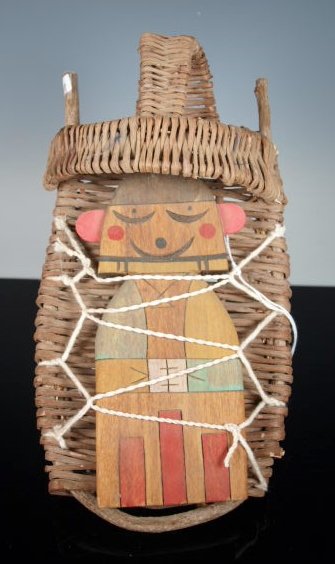 Hopi Cradle Doll w/ Wicker Cradle by James Poley: Traditional "flat doll" in a woven wicker cradle by James Poley, Hotevilla, Hopi, c. 1996. Length: 11 in.