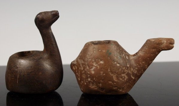 Two ancient Inca Conopa llamas: Pre-Columbian Peruvian - Central Peru Inca Period: Ca. 1400 - 1500 AD Size: 3 1/4 and 2 1/4 inches long Provenance: Private Santa Fe Collection