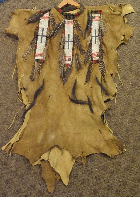 Native American beaded war shirt Plains Indian: Total length approx. 49 inches long. Sewn with Pennalton blanket pieces and three really nice strips of beadwork with American flags, frindge and turkey feathers. Appears to be deer or elk hide.