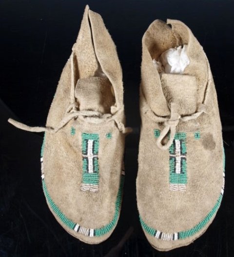Pair of Native American Moccasins, Early 20th C.: Possibly Cheyenne. This pattern was a favorite of a number of Plains tribes. The soles are two layers of thick hide. They wore out nonetheless - there are nickel-sized holes in the soles near the ball