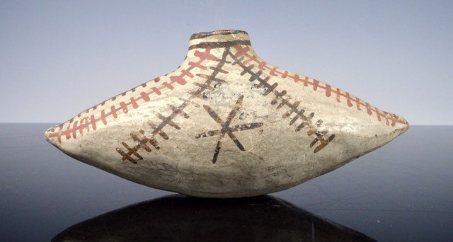 Rare, early Zuni Polychrome Canteen: Rare Zuni Ceremonial Bowl circa 1900-10. Made of clay and measuring 6" x 2" x 2.5". Pottery vessel of the Zuni Pueblo, Central New Mexico, USA. Colors include white, red and black.