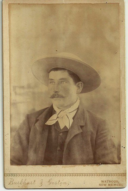 STUNNING WATROUS, NEW MEXICO COWBOY CABINET CARD – ca.: "STUNNING WATROUS, NEW MEXICO COWBOY CABINET CARD – ca. 1877-85. A rare early New Mexico Cowboy-type in a wide-brimmed hat, from unlisted photographers Burkhart & Goston. Provenance suggests this is