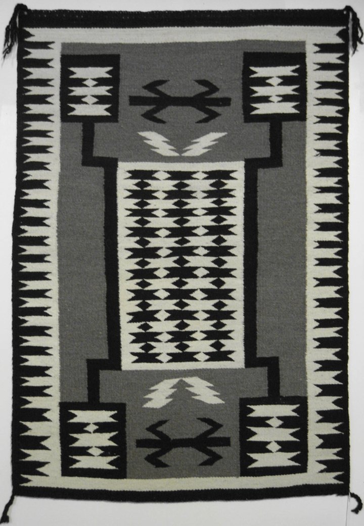 Storm Pattern Rug, Non-Navajo: Storm pattern rug, Gap Area style, non-Navajo. A practical alternative to the real thing in spaces where carpets take excessive beating. Durable weave. Origin: Unknown. Dimensions: 34" x 50".
