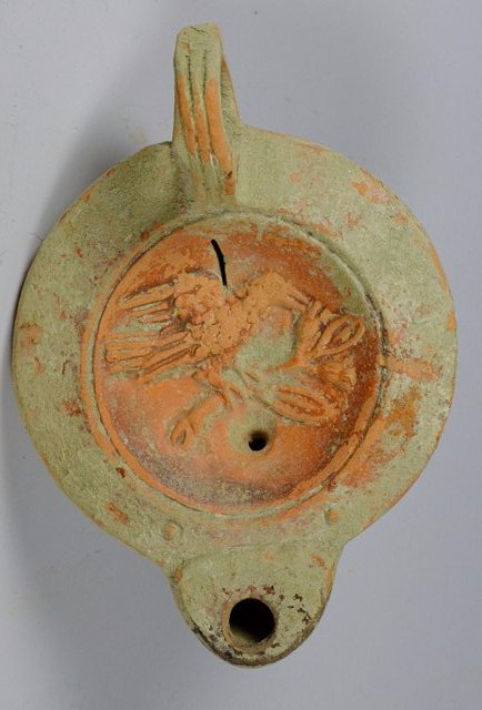 Detailed ancient Roman oil Lamp of Bird: Rome, ca. 1st century CE. Terracotta oil lamp, decorated with bird carring an olive brance. Size: 3 3/4 inches long spout to back (largest). Provenance: Ex- John Hibner, acquired in Turkey during mili