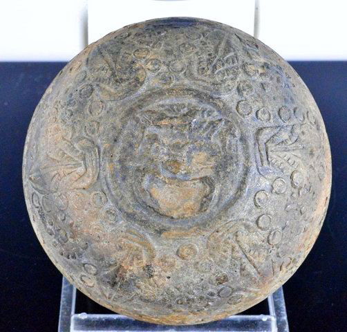 Greek Hellenistic Megarian Dionysus bowl: 2nd - 1st Century BC, the base centering a face of Dionysus, God of wine, molded relief with petals radiating from a central face. Megarian ware is the precursor of the roman Samian ware. 3 1/2 inches