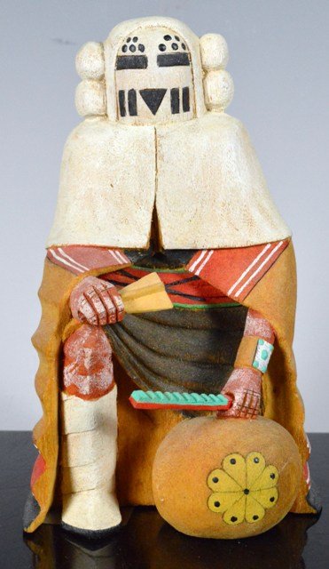 Snow Maiden Kachina/Katsina Doll - Hopi: Hopi Snow Maiden Kachina/Katsina by Colleen Talmivyesa. The cottonwood figure is kneeling with a painted gourd "sounding board" at her feet. She wears a maiden shawl, and a ketoh (bow guard) on her le