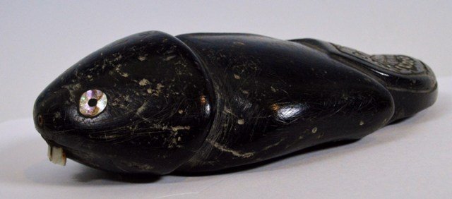 Early Chumash carved Steatite beaver Artifact effigy: Description: Chumash carved Steatite beaver decorated with inset mother-of-pearl and abalone shell beads. The carving is a beaver with crosshachure design on tail and shell teeth. 5 1/2 inches long. C