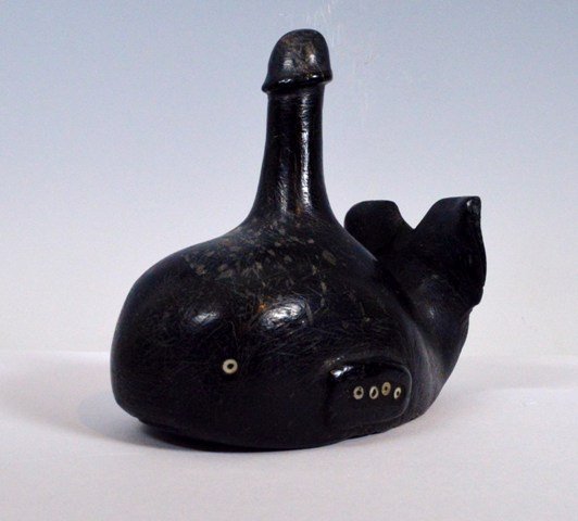 Early Chumash carved Steatite whale Artifact fetish: Description: Chumash carved Steatite whale, with raised tail, and waterspout in phallic form, decorated with inset mother-of-pearl and abalone shell beads. 4 1/4 inches long x 4 inches tall. Culture: